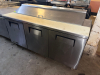 TRUE 72" THREE-DOOR REFRIGERATED SANDWICH/SALAD PREP TABLE WITH STAINLESS STEEL EXTERIOR, THREE SOLID SWING DOORS, REMOVABLE WIRE SHELVING, FULL-LENGTH POLY CUTTING BOARD, AND HINGED TOP INGREDIENT-PAN COMPARTMENT