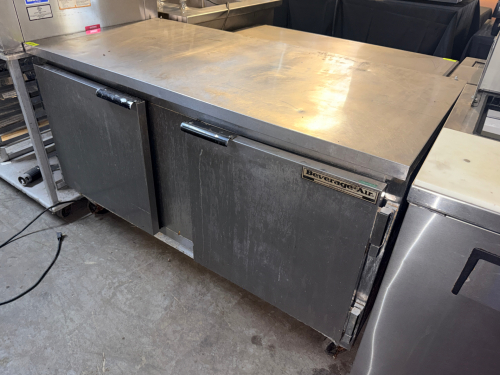 BEVERAGE-AIR TWO-DOOR UNDERCOUNTER REFRIGERATOR WITH STAINLESS STEEL EXTERIOR AND WORKTOP, TWO SOLID SWING DOORS, INTERIOR WIRE SHELVING, SELF-CONTAINED REFRIGERATION SYSTEM, AND CASTERS