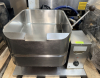 MARKET FORGE ELECTRIC TILTING BRAISING PAN / TILT SKILLET WITH STAINLESS STEEL COOKING PAN, MANUAL TILT LEVER, THERMOSTATIC TEMPERATURE CONTROL, INDICATOR LIGHT, AND STAINLESS STEEL BASE.