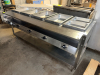 SERVEWELL FIVE-WELL STEAM TABLE / HOT FOOD SERVING TABLE WITH STAINLESS STEEL CONSTRUCTION, INDIVIDUAL WELL CONTROLS, LOWER STORAGE SHELF, CASTERS, AND ASSORTED STAINLESS STEEL FOOD PANS. - 3