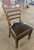 (4) WOOD LADDER BACK CHAIRS W/ BROWN VINYL SEAT CUSHIONS.