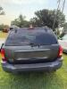 (1) DARK GRAY JEEP GRAND CHEROKEE LAREDO FOUR-DOOR SUV WITH AUTOMATIC TRANSMISSION, 4X4, ROOF RACK, TINTED REAR WINDOWS, ALLOY WHEELS, AND BLACK SEAT COVERS. VEHICLE SHOWS DIRT, CLOUDY HEADLIGHTS, EXTERIOR SCUFFS, MINOR BODY WEAR, AND A MISMATCHED STEEL F - 8