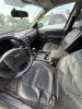 (1) DARK GRAY JEEP GRAND CHEROKEE LAREDO FOUR-DOOR SUV WITH AUTOMATIC TRANSMISSION, 4X4, ROOF RACK, TINTED REAR WINDOWS, ALLOY WHEELS, AND BLACK SEAT COVERS. VEHICLE SHOWS DIRT, CLOUDY HEADLIGHTS, EXTERIOR SCUFFS, MINOR BODY WEAR, AND A MISMATCHED STEEL F - 12