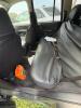 (1) DARK GRAY JEEP GRAND CHEROKEE LAREDO FOUR-DOOR SUV WITH AUTOMATIC TRANSMISSION, 4X4, ROOF RACK, TINTED REAR WINDOWS, ALLOY WHEELS, AND BLACK SEAT COVERS. VEHICLE SHOWS DIRT, CLOUDY HEADLIGHTS, EXTERIOR SCUFFS, MINOR BODY WEAR, AND A MISMATCHED STEEL F - 15