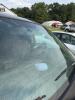 (1) DARK GRAY JEEP GRAND CHEROKEE LAREDO FOUR-DOOR SUV WITH AUTOMATIC TRANSMISSION, 4X4, ROOF RACK, TINTED REAR WINDOWS, ALLOY WHEELS, AND BLACK SEAT COVERS. VEHICLE SHOWS DIRT, CLOUDY HEADLIGHTS, EXTERIOR SCUFFS, MINOR BODY WEAR, AND A MISMATCHED STEEL F - 20