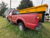 (1) RED FORD F-350 SUPER DUTY REGULAR-CAB PICKUP. TRUCK SHOWS HEAVY WEATHERING, DIRT, RUST, MISSING FRONT GRILLE, MISSING REAR TAILLIGHT ASSEMBLIES, AND OTHER VISIBLE DAMAGE OR INCOMPLETE COMPONENTS. INTERIOR HAS CLOTH BENCH SEAT, MANUAL 4X4 FLOOR SELECTO - 4