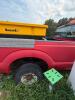 (1) RED FORD F-350 SUPER DUTY REGULAR-CAB PICKUP. TRUCK SHOWS HEAVY WEATHERING, DIRT, RUST, MISSING FRONT GRILLE, MISSING REAR TAILLIGHT ASSEMBLIES, AND OTHER VISIBLE DAMAGE OR INCOMPLETE COMPONENTS. INTERIOR HAS CLOTH BENCH SEAT, MANUAL 4X4 FLOOR SELECTO - 8