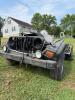 (1) BLACK JEEP WRANGLER PROJECT VEHICLE WITH REMOVABLE SOFT-TOP COMPONENTS, ROUND-HEADLIGHT GRILLE, AFTERMARKET WHEELS, GOODYEAR WRANGLER TIRES, SIDE STEPS, FRONT AUXILIARY LIGHTS, FUEL TANK, SUSPENSION, AXLES, AND VARIOUS LOOSE PARTS. VEHICLE PRESENTS A 