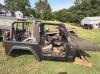 (1) BLACK JEEP WRANGLER PROJECT VEHICLE WITH REMOVABLE SOFT-TOP COMPONENTS, ROUND-HEADLIGHT GRILLE, AFTERMARKET WHEELS, GOODYEAR WRANGLER TIRES, SIDE STEPS, FRONT AUXILIARY LIGHTS, FUEL TANK, SUSPENSION, AXLES, AND VARIOUS LOOSE PARTS. VEHICLE PRESENTS A - 15