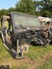 (1) BLACK JEEP WRANGLER 4.0L SPORT OFFERED AS A PROJECT, RESTORATION, OR PARTS VEHICLE. INCLUDES BODY TUB, WINDSHIELD FRAME AND GLASS, ROLL BAR ASSEMBLY, DAMAGED SOFT TOP, DASH COMPONENTS, STEERING WHEEL, BUMPERS, FENDER FLARES, SIDE STEPS, AND ASSORTED L