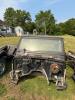 (1) BLACK JEEP WRANGLER 4.0L SPORT OFFERED AS A PROJECT, RESTORATION, OR PARTS VEHICLE. INCLUDES BODY TUB, WINDSHIELD FRAME AND GLASS, ROLL BAR ASSEMBLY, DAMAGED SOFT TOP, DASH COMPONENTS, STEERING WHEEL, BUMPERS, FENDER FLARES, SIDE STEPS, AND ASSORTED L - 2