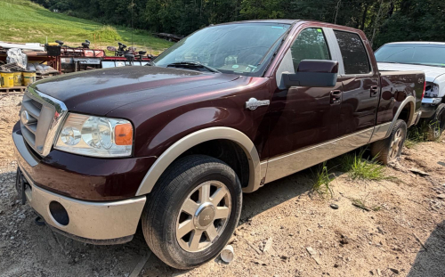 (1) BURGUNDY AND TAN FEATURING FOUR-WHEEL DRIVE, AUTOMATIC TRANSMISSION, KING RANCH LEATHER INTERIOR, POWER FRONT SEATS, CREW-CAB SEATING, SUNROOF, FACTORY AUDIO/CLIMATE CONTROLS, ALLOY WHEELS, FOG LIGHTS, BED RAIL CAPS, AND KEYLESS-ENTRY KEYPAD. ENGINE,