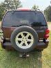 (1) MAROON FOUR-DOOR JEEP LIBERTY LIMITED EQUIPPED WITH A 3.7L V6 ENGINE, AUTOMATIC TRANSMISSION, SUNROOF, ROOF RACK, RUNNING BOARDS, REAR-MOUNTED SPARE TIRE, AND CLOTH INTERIOR. ODOMETER DISPLAYS 172,062 MILES. SOLD AS SHOWN. - 4