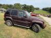 (1) MAROON FOUR-DOOR JEEP LIBERTY LIMITED EQUIPPED WITH A 3.7L V6 ENGINE, AUTOMATIC TRANSMISSION, SUNROOF, ROOF RACK, RUNNING BOARDS, REAR-MOUNTED SPARE TIRE, AND CLOTH INTERIOR. ODOMETER DISPLAYS 172,062 MILES. SOLD AS SHOWN. - 6