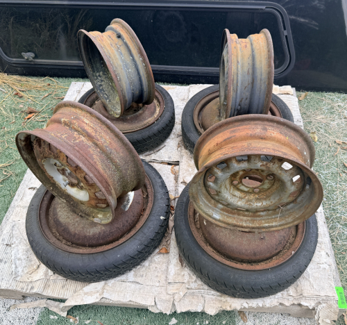 VINTAGE 4-LUG STEEL WHEELS. WHEELS ARE WELDED TOGTHER TO MAKE JACK STAND.