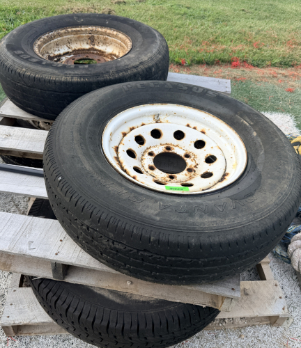 (4) TRAILER TIRE MOUNTED ON 8-LUG WHITE STEEL WHEEL.