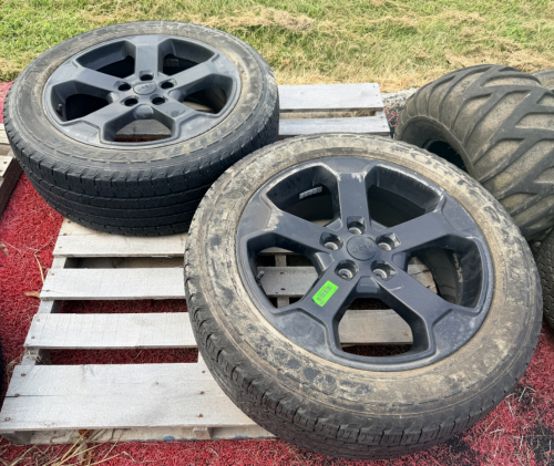 2 JEEP 5-SPOKE ALLOY WHEELS WITH GOODYEAR FORTERA HL TIRES.