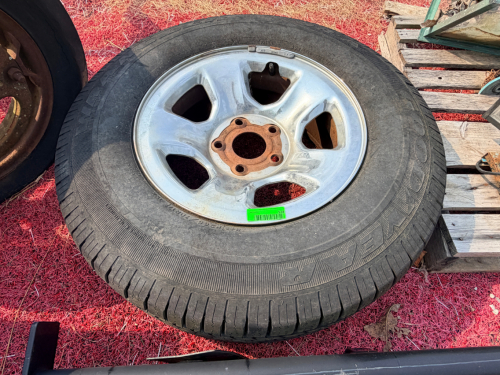 SINGLE GOODYEAR WRANGLER TIRE MOUNTED ON 6-LUG ALUMINUM WHEEL.