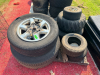 MISCELLANEOUS LOT OF USED TIRES, WHEELS, AND LAWN EQUIPMENT TIRES. SOLD AS ONE LOT.