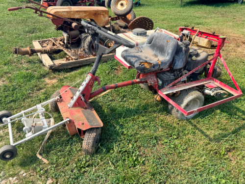 RIDE-ON SPRAYER WITH FRONT BOOM SPRAY ASSEMBLY. UNIT FEATURES A POLY SOLUTION TANK, BRIGGS & STRATTON GASOLINE ENGINE, FRONT-MOUNT SPRAY BOOM, AND REAR CARGO FRAME. SHOWS NORMAL WEAR, TORN SEAT, AND DUST FROM USE. OPERATING CONDITION IS UNKNOWN. SOLD AS S