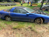 1998 CHEVROLET CAMARO COUPE. VEHICLE HAS BEEN STORED OUTDOORS AND IS BEING SOLD IN NON-RUNNING CONDITION. HOOD IS MISSING. ENGINE APPEARS INCOMPLETE. INTERIOR IS PRESENT BUT DIRTY WITH SIGNS OF LONG-TERM STORAGE. BODY SHOWS COSMETIC WEAR, WEATHERING, AND - 4