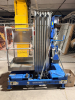 GENIE VERTICAL PERSONNEL LIFT WITH TELESCOPING ALUMINUM MAST, ALUMINUM WORK PLATFORM WITH GUARDRAILS, PLATFORM CONTROLS, GROUND CONTROLS, EMERGENCY STOP, OUTRIGGERS, HYDRAULIC LIFT SYSTEM, BATTERY CHARGER, AND MANUAL-ROLLING BASE. - 2