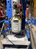 GENIE VERTICAL PERSONNEL LIFT WITH TELESCOPING ALUMINUM MAST, ALUMINUM WORK PLATFORM WITH GUARDRAILS, PLATFORM CONTROLS, GROUND CONTROLS, EMERGENCY STOP, OUTRIGGERS, HYDRAULIC LIFT SYSTEM, BATTERY CHARGER, AND MANUAL-ROLLING BASE. - 5
