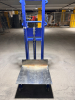 MANUAL HYDRAULIC PLATFORM LIFT TRUCK WITH STEEL FRAME, LARGE METAL LOAD PLATFORM, FOOT-OPERATED HYDRAULIC LIFT, CHAIN LIFT MECHANISM, PUSH HANDLE, AND CASTER WHEELS. 1,000-LB. RATED CAPACITY