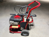 CRAFTSMAN GAS-POWERED PRESSURE WASHER WITH 2,500 PSI MAXIMUM PRESSURE, 2.5 GPM FLOW RATE, 6.75 HP ENGINE, HIGH-PRESSURE HOSE, SPRAY WAND, DUAL DETERGENT TANKS, DIAL-A-CLEANER CONTROL, AND PNEUMATIC TRANSPORT WHEELS.