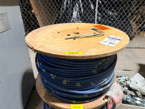 SPOOL OF TYPE MC STEEL ARMORED METAL-CLAD CABLE WITH COPPER CONDUCTORS, THHN/THWN INSULATION, AND GREEN INSULATED EQUIPMENT GROUNDING CONDUCTOR. FACTORY-WOUND ON WOODEN CABLE REEL.