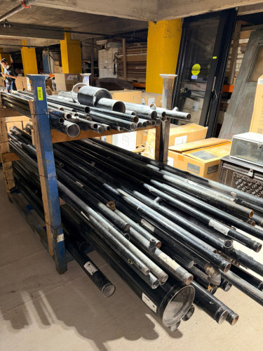 LOT OF ASSORTED BLACK STEEL AND GALVANIZED STEEL PIPE INCLUDING MULTIPLE DIAMETERS AND LENGTHS, WITH THREADED AND PLAIN ENDS. LOT INCLUDES SCHEDULE 40 BLACK STEEL PIPE, GALVANIZED PIPE, LARGE-DIAMETER PIPE, AND ASSORTED INSTALLED FITTINGS INCLUDING ELBOWS
