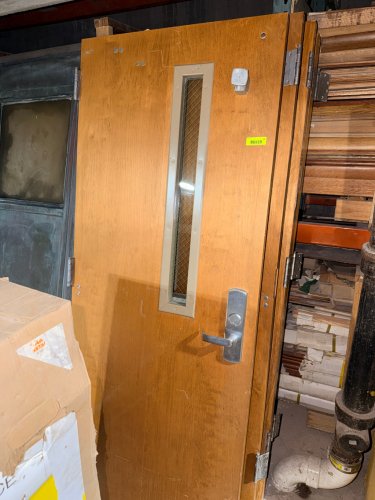 (2) SETS OF DOUBLE WOOD VENEER COMMERCIAL FIRE-RATED DOOR WITH NARROW VISION LITE, WIRE-REINFORCED GLASS, LEVER LOCKSET, CLOSER HARDWARE, HINGES, AND PANIC EXIT DEVICE.