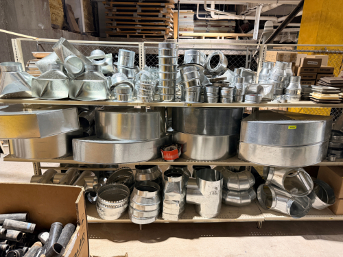 LARGE ASSORTMENT OF GALVANIZED STEEL HVAC DUCTWORK AND FITTINGS INCLUDING ROUND DUCT CONNECTORS, REDUCERS, ELBOWS, TAKEOFFS, COLLARS, BOOTS, PLENUMS, TRANSITIONS, DAMPERS, REGISTER BOXES, AND LARGE RADIUS/OVAL DUCT SECTIONS. LOT CONTAINS A LARGE QUANTITY 