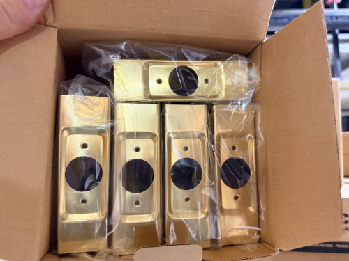 COMMERCIAL DOOR PUSH PLATES / ESCUTCHEON PLATES WITH BRASS-TONE FINISH, RECTANGULAR CONSTRUCTION, CENTER LOCKSET OPENING, AND MOUNTING HOLES.