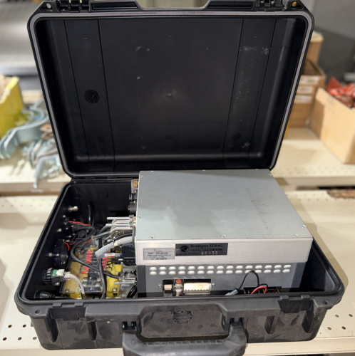 PORTABLE ELECTRONIC CONTROL AND DATA ACQUISITION SYSTEM HOUSED IN A HARD-SHELL EQUIPMENT CASE, WITH INTEGRATED POWER DISTRIBUTION, CAMERA CONNECTIONS, NETWORK INTERFACE, COOLING FANS, FUSES, AND MULTIPLE DATA / CONTROL CONNECTORS.