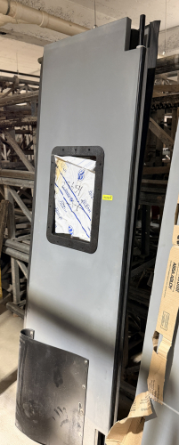 (1) SET OF COMMERCIAL TRAFFIC DOUBLE DOORS WITH GRAY FINISH, RECTANGULAR VISION WINDOW, BLACK PERIMETER EDGE TRIM, AND STAINLESS STEEL LOWER KICK/IMPACT PLATE. PANEL INCLUDES HEAVY-DUTY HARDWARE COMPONENTS AND MOLDED BLACK IMPACT PROTECTION.