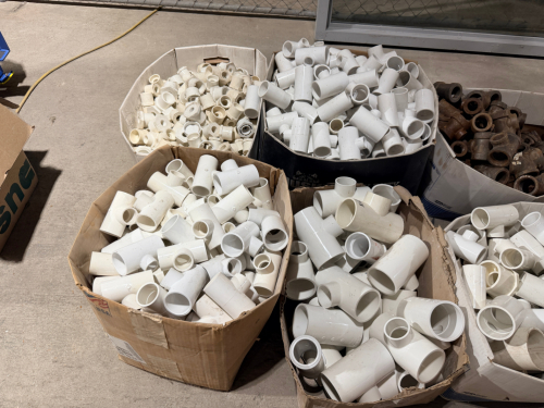 (7) BOXES OF WHITE PVC PIPE FITTINGS, INCLUDING TEES, COUPLINGS, REDUCERS, ADAPTERS, ELBOWS, WYES, BUSHINGS, AND OTHER ASSORTED FITTINGS.