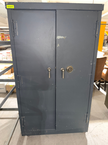 VINTAGE HEAVY-DUTY STEEL SECURITY STORAGE CABINET WITH DOUBLE SWING DOORS, THREE-POINT STYLE DOOR HARDWARE, COMBINATION DIAL LOCK, INTERIOR SHELVING, AND A CUSTOM NOTCHED STORAGE RACK