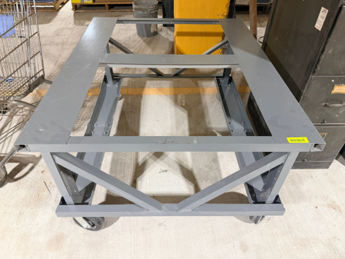 HEAVY-DUTY STEEL MOBILE EQUIPMENT BASE / MACHINE STAND WITH WELDED AND BOLTED RECTANGULAR FRAME CONSTRUCTION, CROSS-BRACING, OPEN CENTER, AND FOUR HEAVY-DUTY CASTER WHEELS.