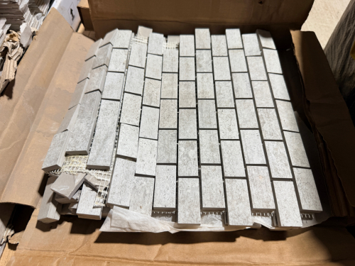 (4) BOXES OF WHITE/GRAY RECTANGULAR MOSAIC TILE SHEETS WITH SMALL BRICK-PATTERN TILES. EACH BOX HAS 6 SHEETS.