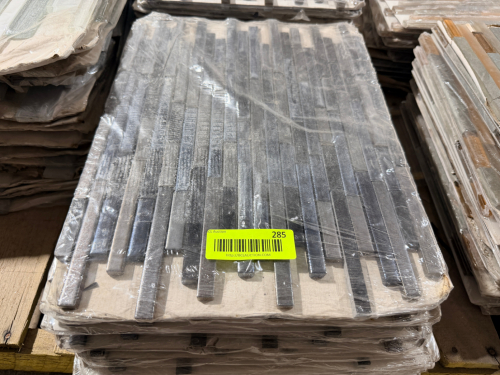 (48) SHEETS OF DARK GRAY LINEAR MOSAIC TILE SHEETS FEATURING NARROW RECTANGULAR PIECES WITH VARIED LENGTHS AND A TEXTURED FINISH.
