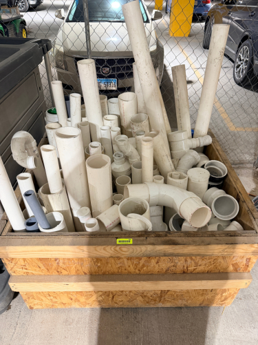 ASSORTED PVC PIPE AND FITTINGS LOT CONSISTING OF A LARGE QUANTITY OF WHITE PVC PIPE SECTIONS AND ASSORTED FITTINGS IN MULTIPLE DIAMETERS. INCLUDES ELBOWS, COUPLINGS, REDUCERS, TEES, CAPS, ADAPTERS, LARGE-DIAMETER FITTINGS, AND VARIOUS CUT LENGTHS OF PIPE.
