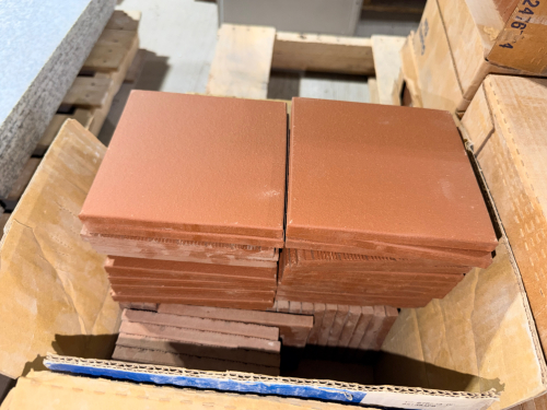 (11) CASES OF RED/BROWN CERAMIC QUARRY TILE. TILES HAVE A MATTE, SLIGHTLY TEXTURED SURFACE WITH SQUARE FORMAT. CASE LABEL IDENTIFIES COLOR 0N01 LAVA RED AND SHADE 661P.