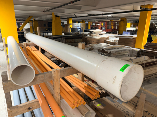 LOT OF LARGE-DIAMETER WHITE PVC PIPE CONSISTING OF TWO LONG STRAIGHT PIPE SECTIONS. PIPE HAS HEAVY-WALL CONSTRUCTION WITH APPROXIMATE DIAMETERS OF 10" AND 6".