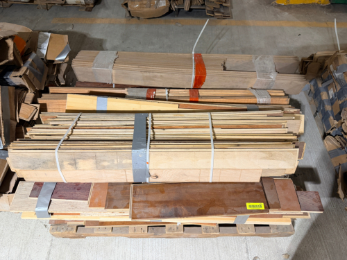 (1) PALLET OF ASSORTED HARDWOOD FLOORING PLANKS IN VARIOUS SPECIES AND FINISHES.