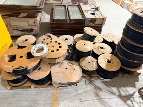 LOT OF ASSORTED BLACK EXTRUDED PLASTIC / RUBBER PROFILE MATERIAL, RUBBER AND FELT WEATHER STRIPPING. ON ASSORTED CARDBOARD REELS. LOT INCLUDES MULTIPLE PARTIAL AND FULL REELS OF VARIOUS SIZES AND QUANTITIES