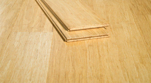 (2) BOXES OF TITAN SERIES HARDWOOD FLOORING CONSISTING OF PREFINISHED TONGUE-AND-GROOVE WOOD PLANKS IN NATURAL AND DARK WOOD FINISHES.