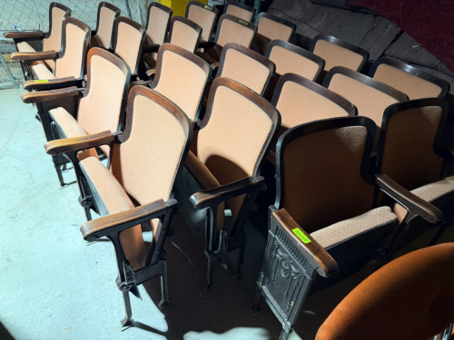 (5) VINTAGE FIXED AUDITORIUM/THEATER DOUBLE SEATS FEATURING UPHOLSTERED SEAT CUSHIONS AND BACKRESTS, MOLDED WOOD BACK FRAMES, WOOD ARMRESTS, CAST/METAL SUPPORT FRAMES, AND FLOOR-MOUNTING FEET.