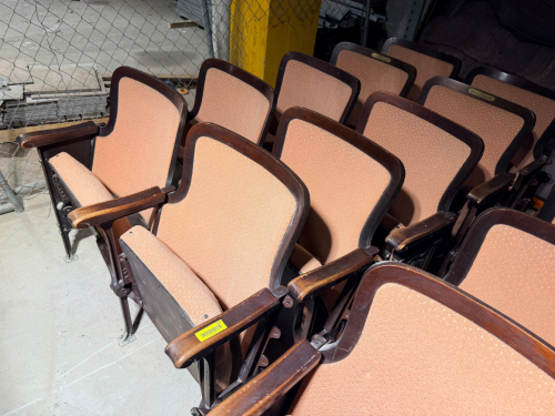 (5) VINTAGE FIXED AUDITORIUM/THEATER DOUBLE SEATS FEATURING UPHOLSTERED SEAT CUSHIONS AND BACKRESTS, MOLDED WOOD BACK FRAMES, WOOD ARMRESTS, CAST/METAL SUPPORT FRAMES, AND FLOOR-MOUNTING FEET.