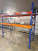 (2) 8' X 42" SECTIONS OF HEAVY-DUTY STEEL PALLET RACKING WITH ORANGE HORIZONTAL LOAD BEAMS, BLUE STEEL UPRIGHTS, AND WIRE DECKING. EACH SECTION INCLUDES TWO ELEVATED STORAGE LEVELS WITH WIRE DECK PANELS. - 2